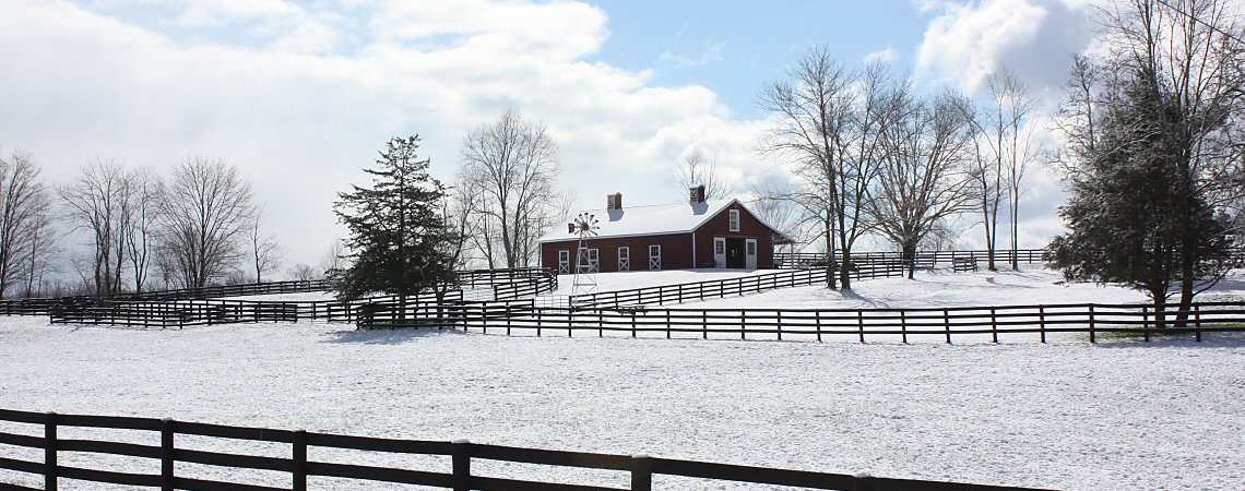 Barn on a Snowy Hill